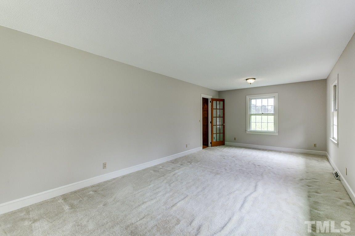 716 Sheriff Johnson Road Coats, NC 27521 - Photo 4 of 25 a view of an empty room with a window