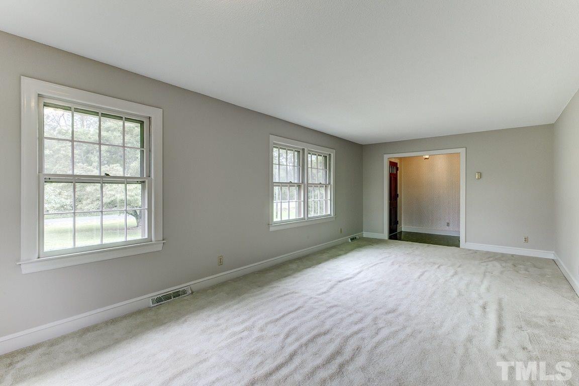 716 Sheriff Johnson Road Coats, NC 27521 - Photo 5 of 25 an empty room with windows