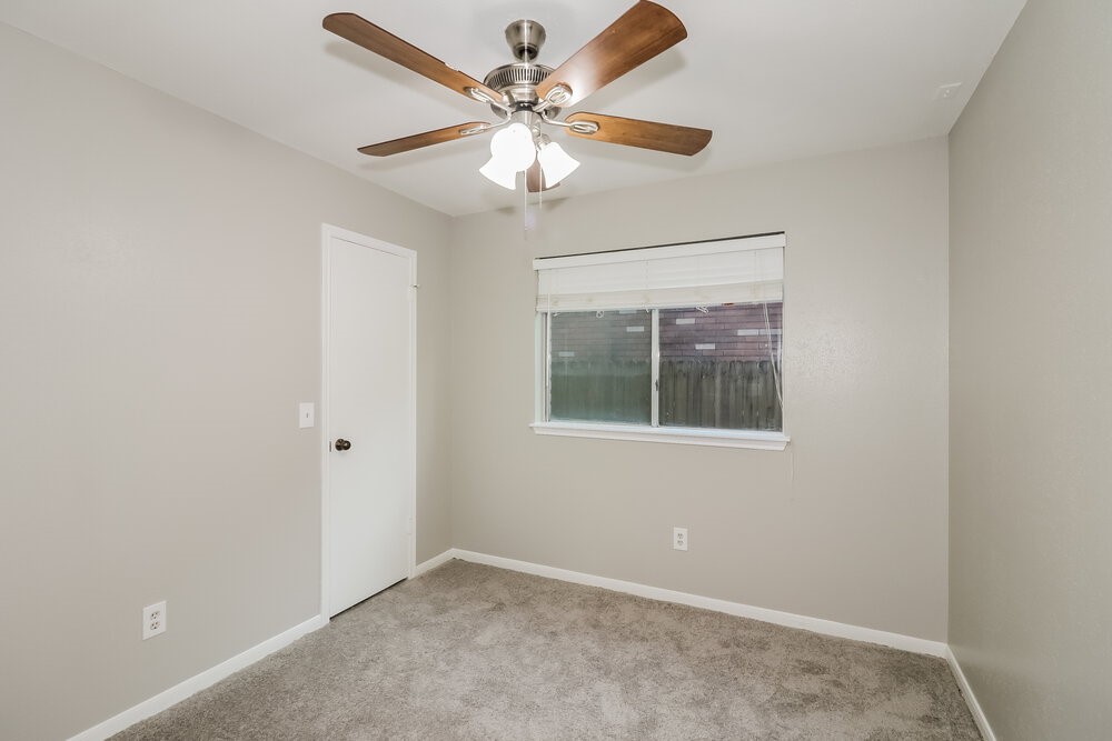 9423 Bayou Bluff Drive Spring, TX 77379 - Photo 13 of 16 an empty room with windows and fan