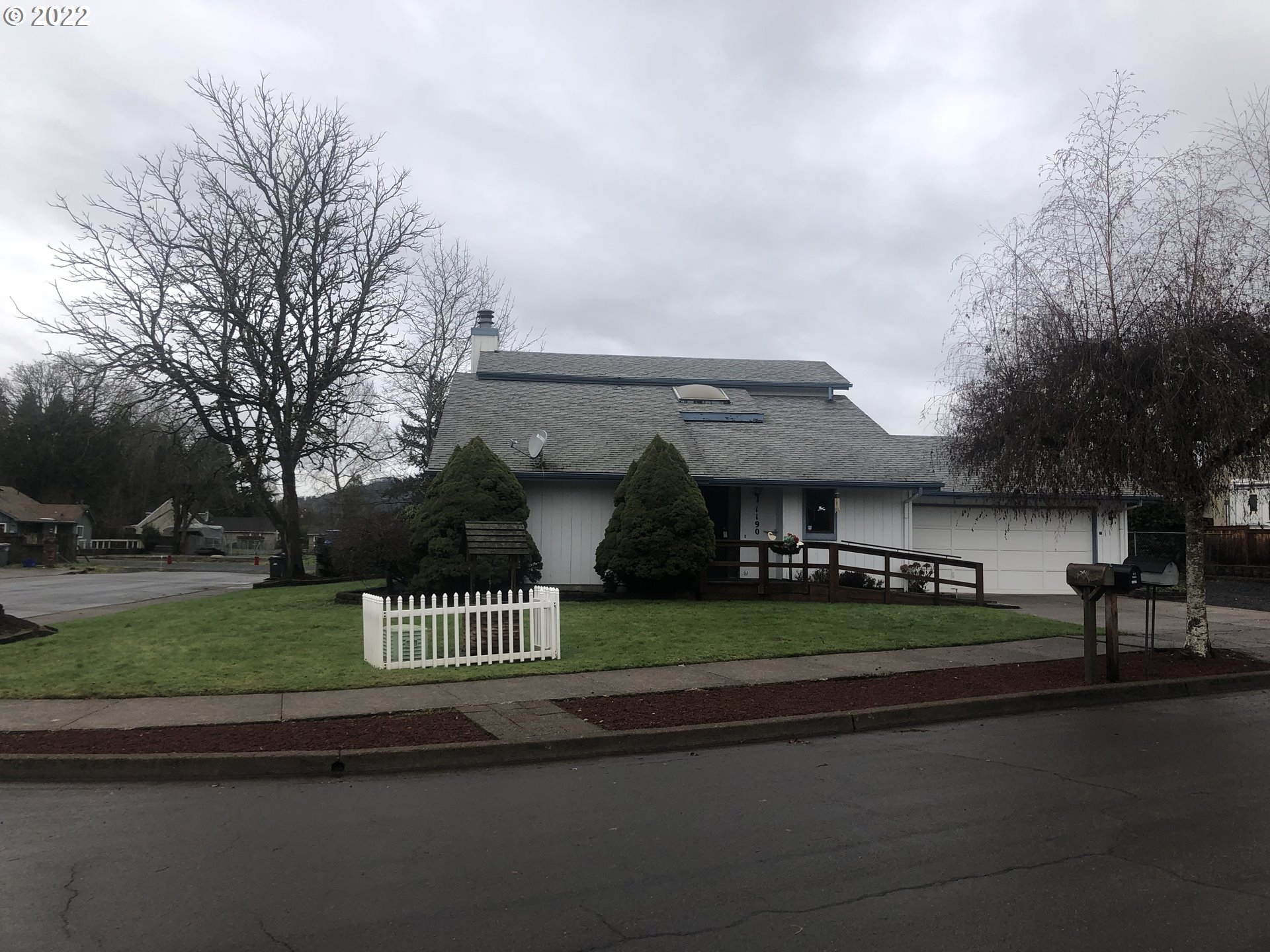 1190 South 44th Street Springfield, OR 97478 - Photo 1 of 9 a front view of a house with a garden and plants