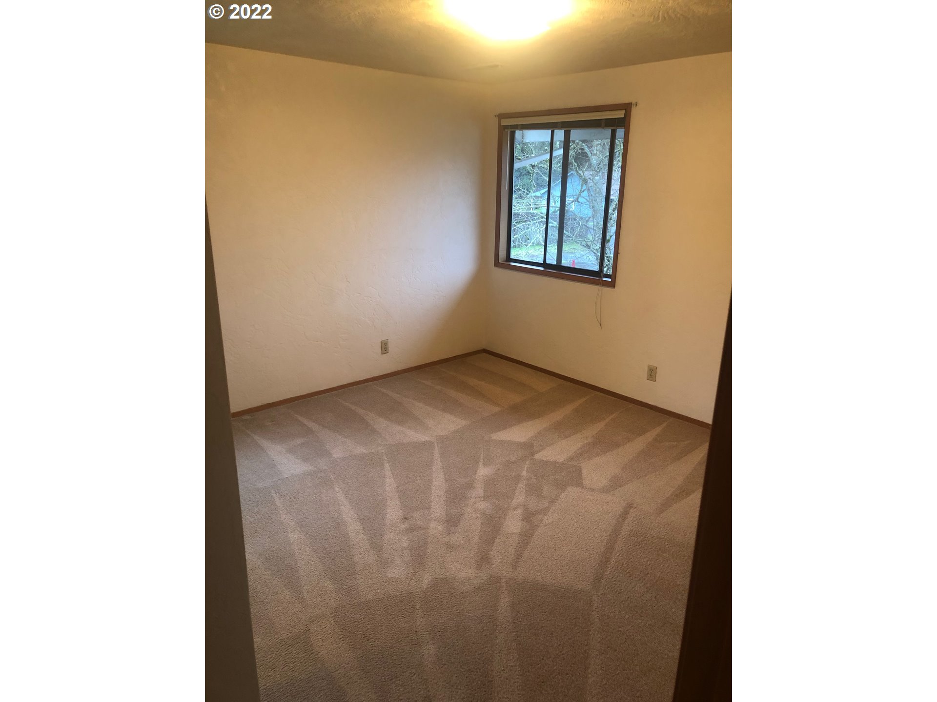 1190 South 44th Street Springfield, OR 97478 - Photo 7 of 9 a view of an empty room with windows