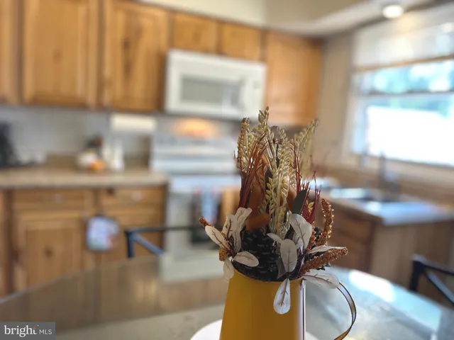 a vase of flowers sitting on a table