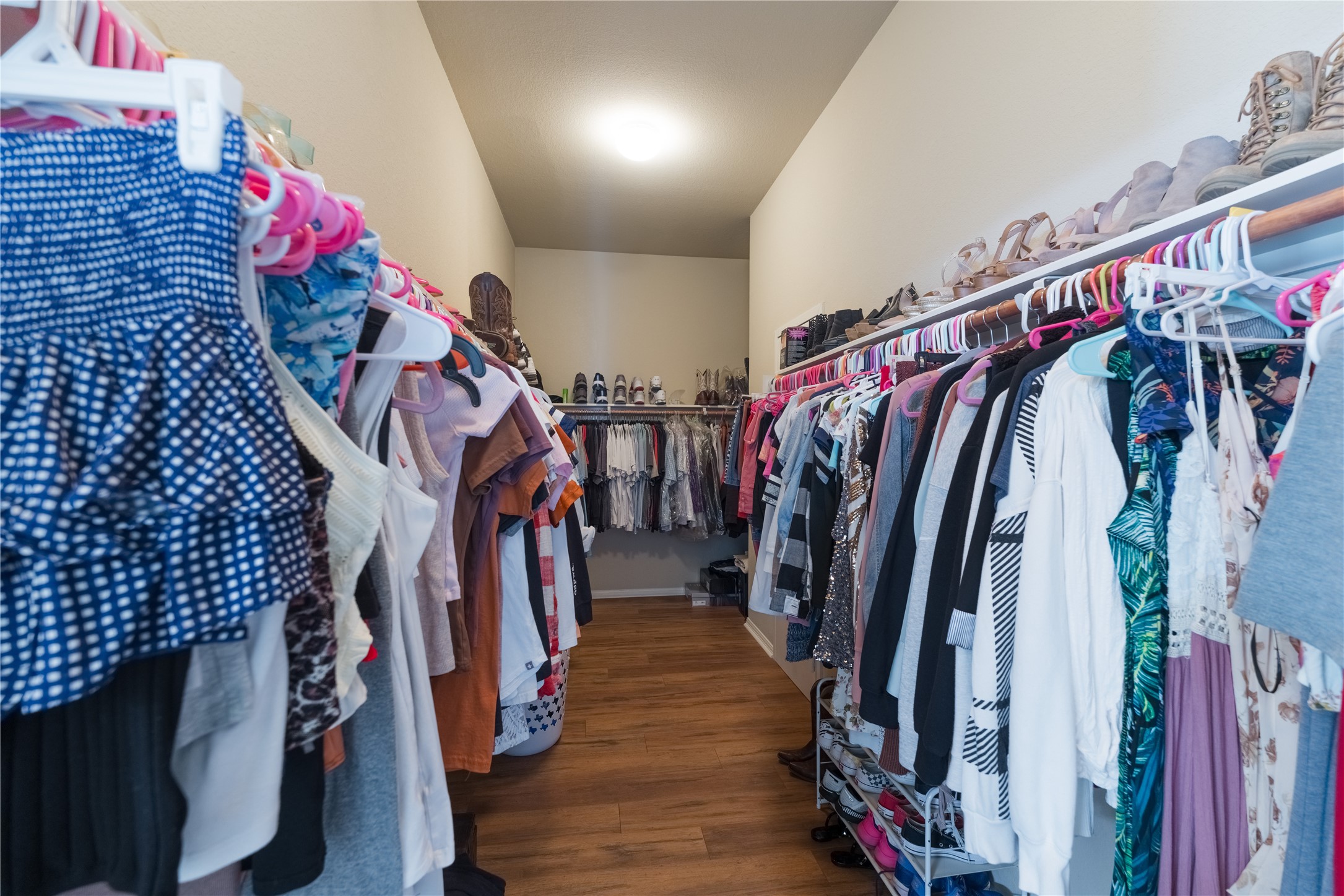 20145 Janak Road Coupland, TX 78615 - Photo 18 of 40 Ample hanging space and integrated shelving optimize this spacious Master bedroom walk-in closet.
