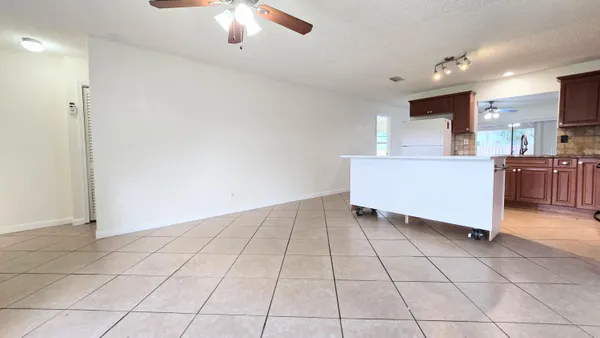 a view of kitchen with furniture and window