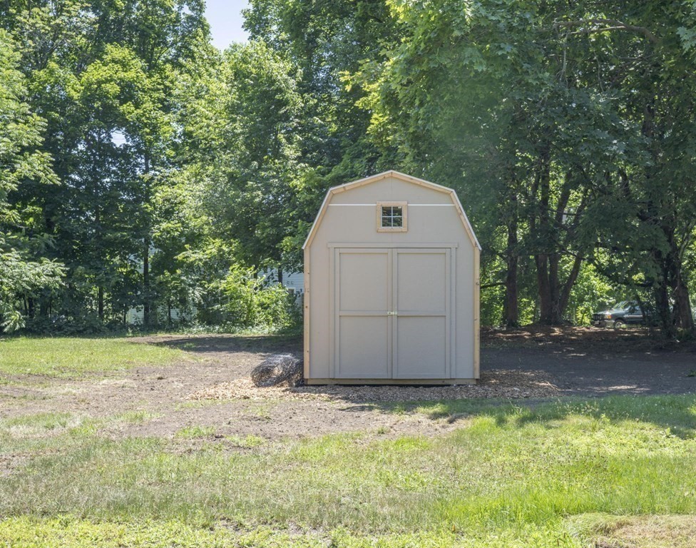 10 R Poquanticut Avenue Easton, MA 02375 - Photo 12 of 38 a view of a tiny house with a yard
