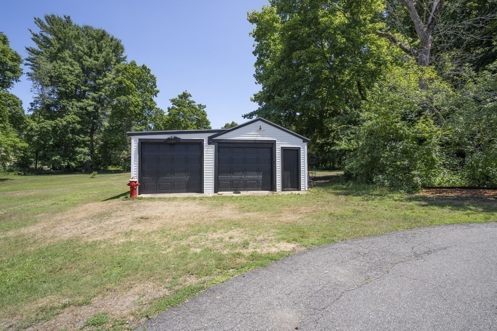 10 R Poquanticut Avenue Easton, MA 02375 - Photo 13 of 38 a front view of house with yard and trees