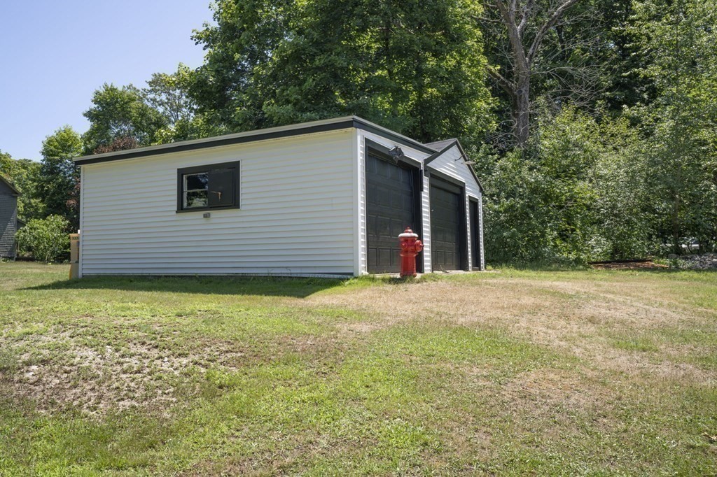 10 R Poquanticut Avenue Easton, MA 02375 - Photo 14 of 38 a backyard of a house with lots of green space