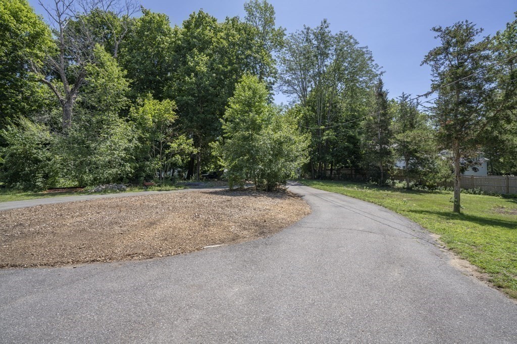 10 R Poquanticut Avenue Easton, MA 02375 - Photo 16 of 38 a view of a field with plants and trees