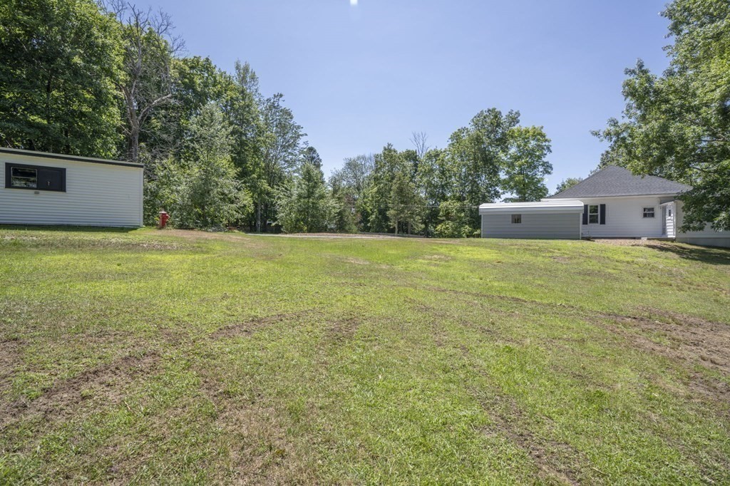 10 R Poquanticut Avenue Easton, MA 02375 - Photo 18 of 38 a view of a big yard with a house