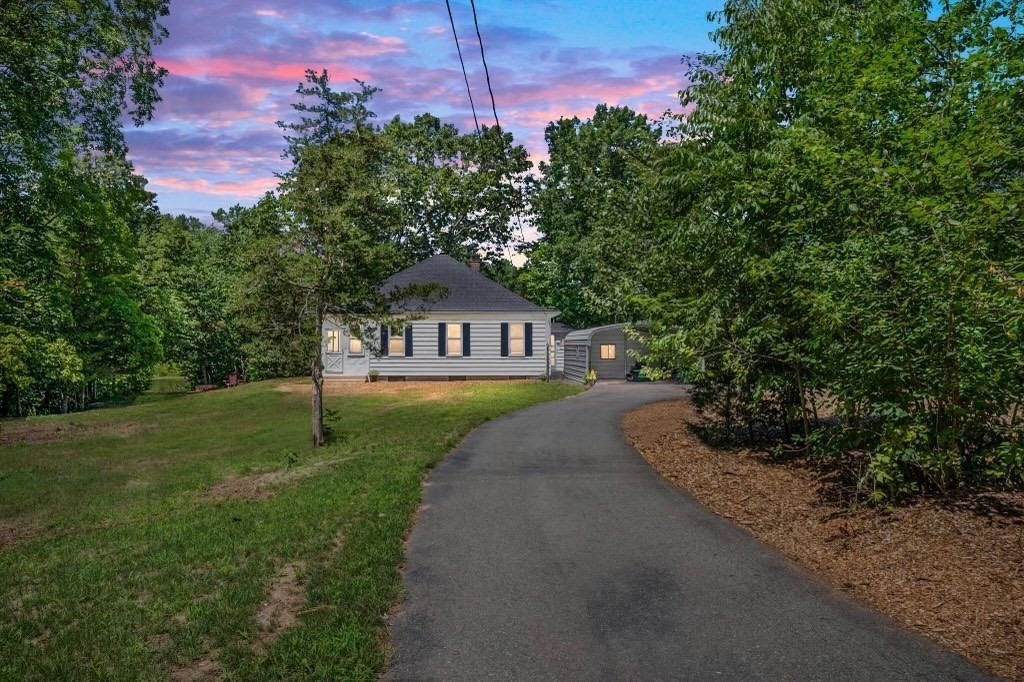10 R Poquanticut Avenue Easton, MA 02375 - Photo 2 of 38 a front view of a house with garden