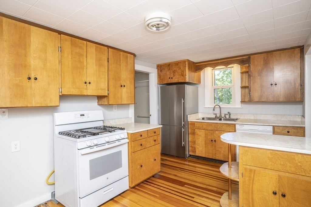 10 R Poquanticut Avenue Easton, MA 02375 - Photo 23 of 38 a kitchen with stainless steel appliances granite countertop a sink stove and refrigerator