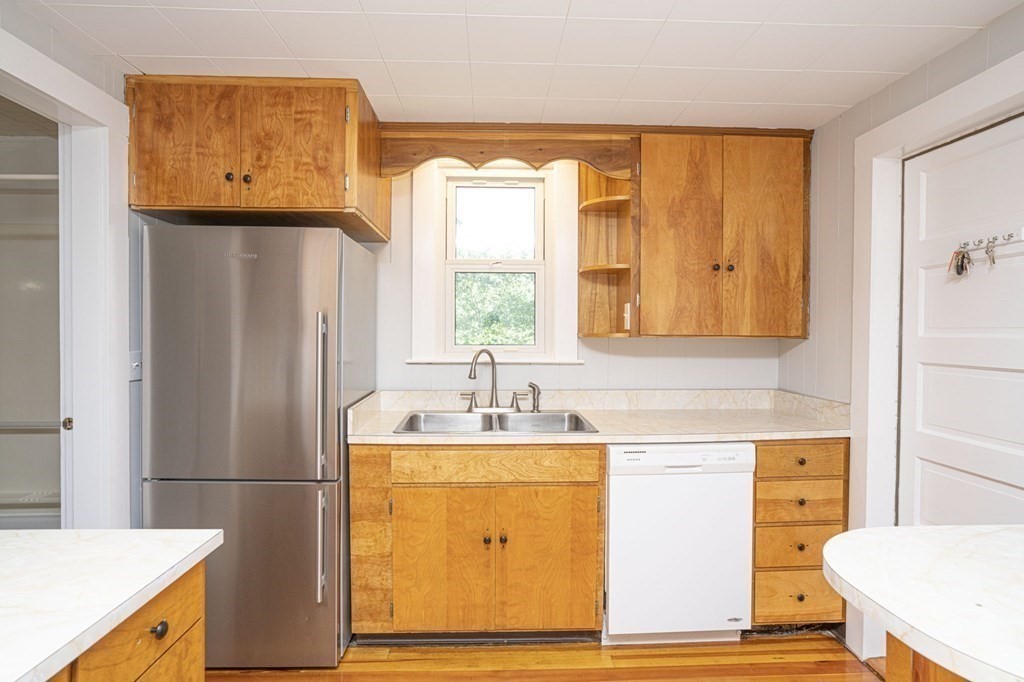 10 R Poquanticut Avenue Easton, MA 02375 - Photo 24 of 38 a bathroom with a sink a mirror and a shower