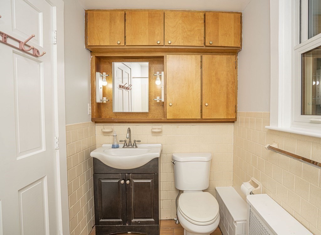 10 R Poquanticut Avenue Easton, MA 02375 - Photo 25 of 38 a bathroom with a sink a toilet and mirror