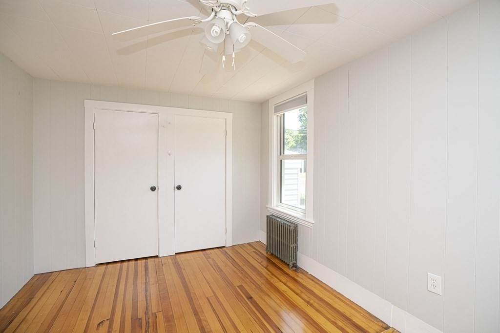10 R Poquanticut Avenue Easton, MA 02375 - Photo 27 of 38 a view of an empty room with wooden floor and a window