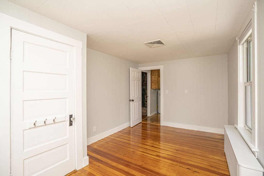 10 R Poquanticut Avenue Easton, MA 02375 - Photo 29 of 38 a view of empty room with wooden floor