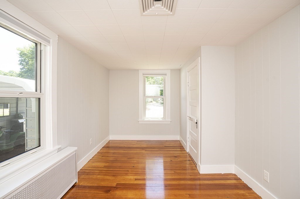 10 R Poquanticut Avenue Easton, MA 02375 - Photo 31 of 38 a view of a hallway with wooden floor and a window
