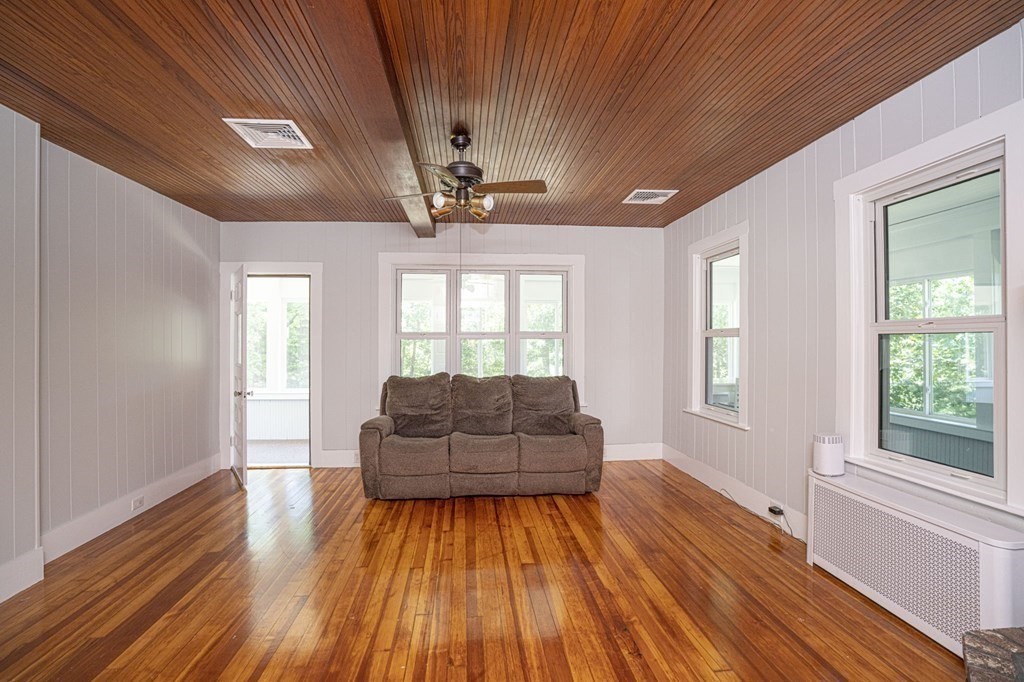 10 R Poquanticut Avenue Easton, MA 02375 - Photo 32 of 38 a living room with furniture and wooden floor