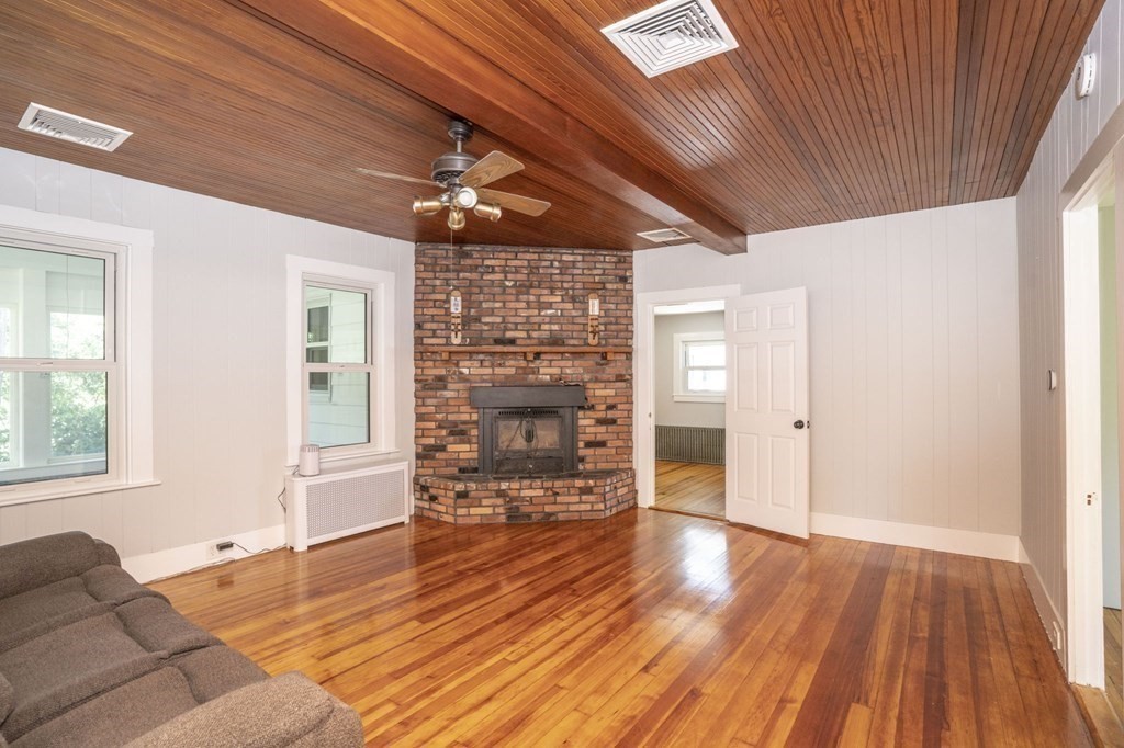 10 R Poquanticut Avenue Easton, MA 02375 - Photo 33 of 38 a furnished livingroom with windows and wooden floor