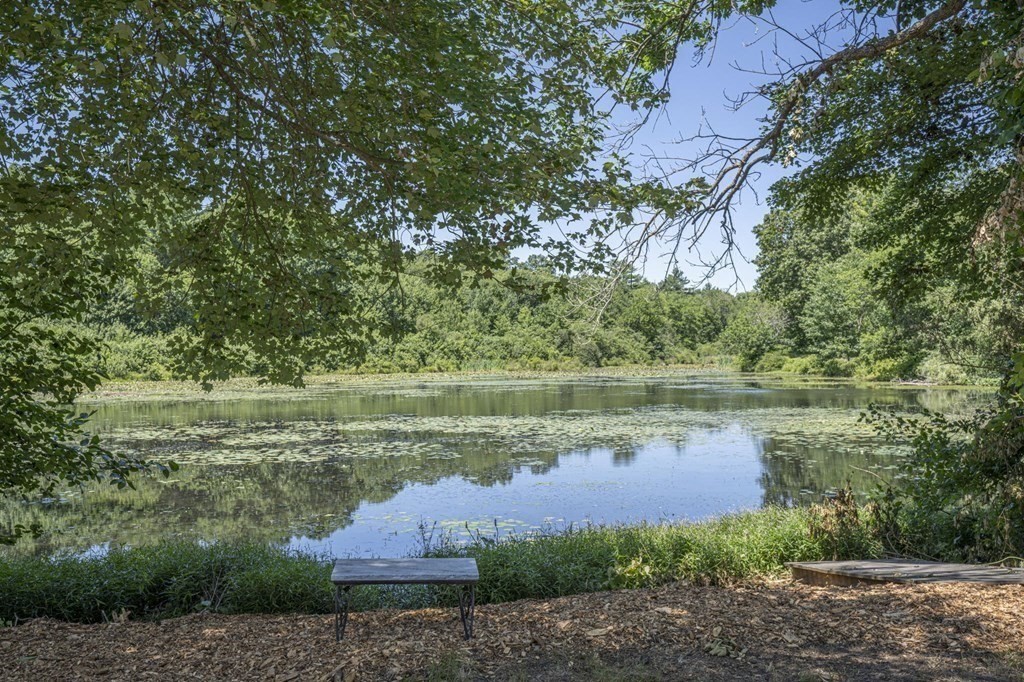 10 R Poquanticut Avenue Easton, MA 02375 - Photo 4 of 38 a view of a lake in between two large trees