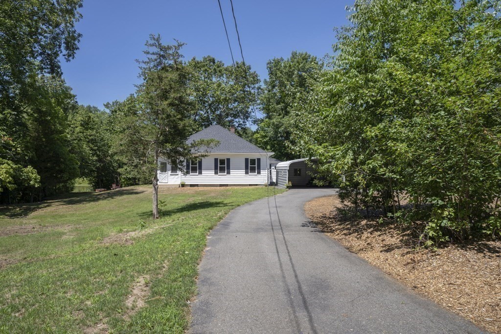 10 R Poquanticut Avenue Easton, MA 02375 - Photo 8 of 38 a front view of a house with garden