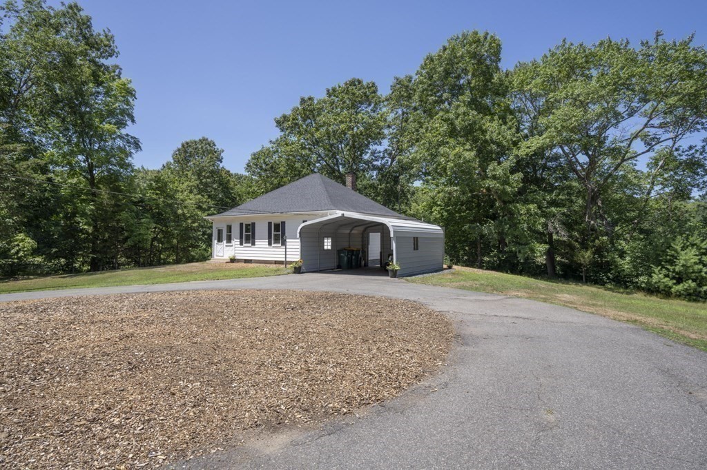 10 R Poquanticut Avenue Easton, MA 02375 - Photo 9 of 38 a house with trees in the background