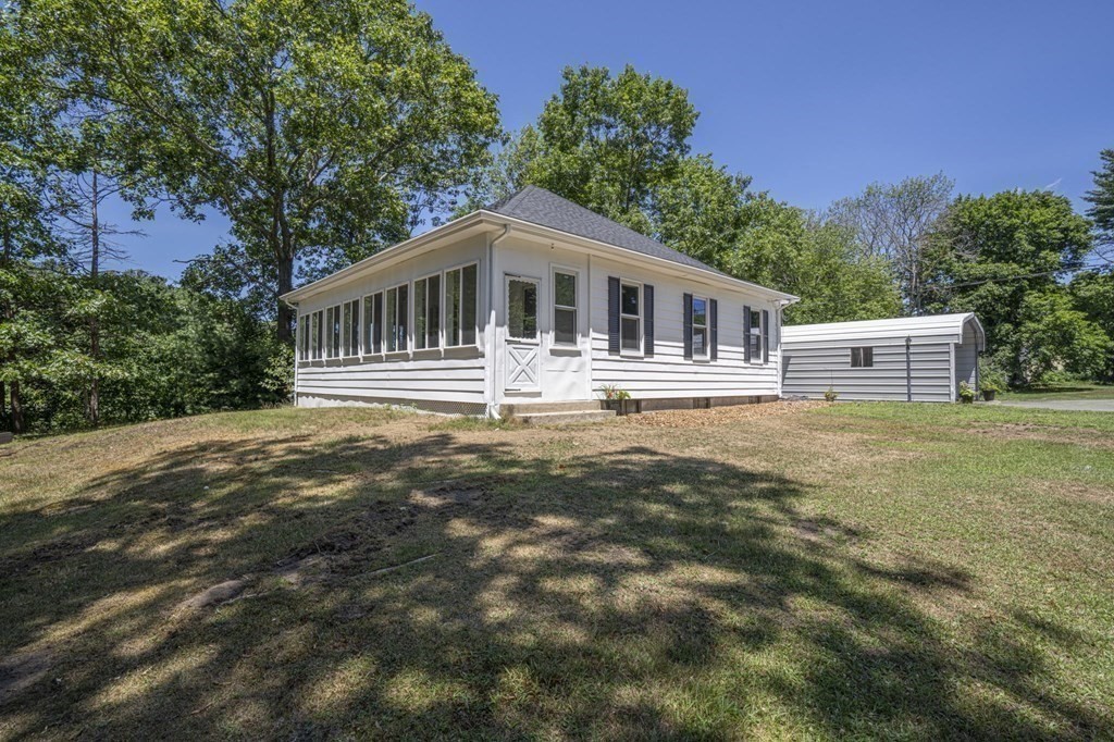 10 R Poquanticut Avenue Easton, MA 02375 - Photo 10 of 38 a front view of a house with a yard
