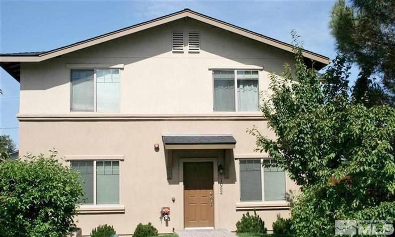 1052 Watt Street Reno, NV 89509 - Photo 1 of 25 front view of a house with a small yard