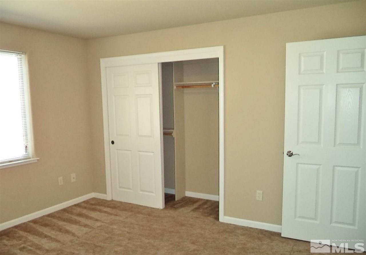 1052 Watt Street Reno, NV 89509 - Photo 17 of 25 an empty room that has a wooden door in it