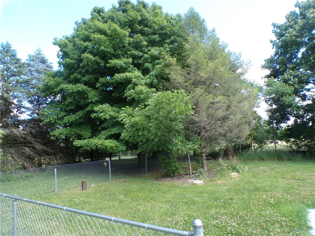 7877 Gun Club Road New Tripoli, PA 18066 - Photo 17 of 19 Mature trees and a lush lawn define this private outdoor space.