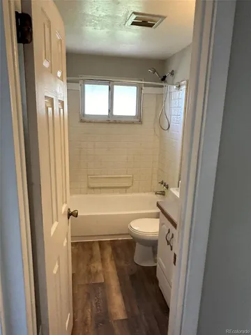 a bathroom with a toilet sink and a bathtub