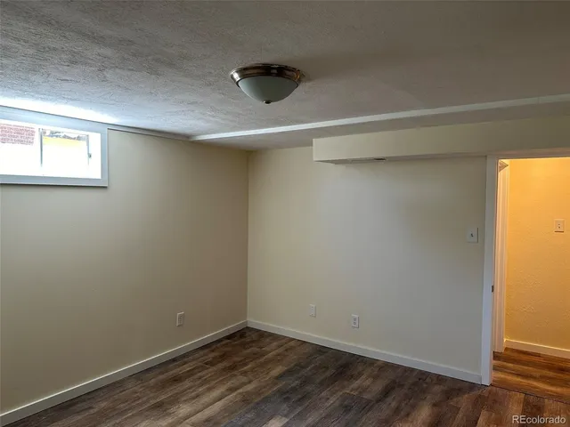 a view of a small space with wooden floor