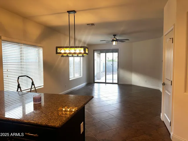 a view of a room with furniture and window