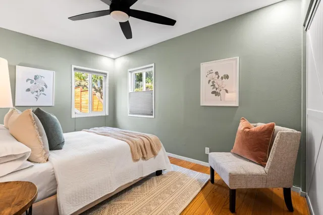 a bedroom with a bed and chair