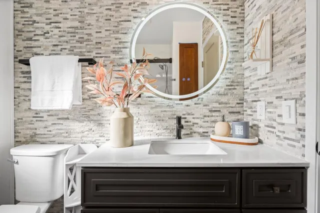 a bathroom with a sink and a mirror