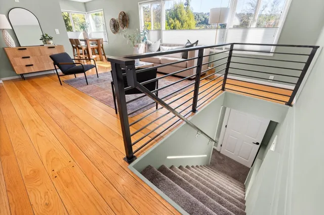 a view of a living room and a wooden floor