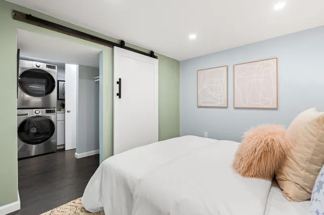 a bedroom with a bed and a view of bedroom