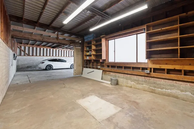a view of water heater room with windows