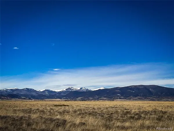 a view of an ocean and a mountain