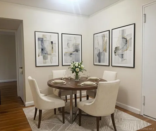 a dining room with furniture and wooden floor