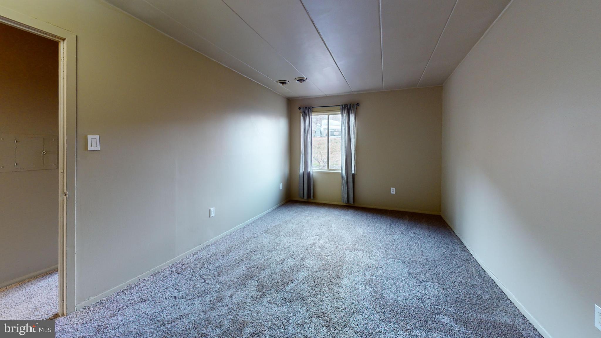 2612 Fort Farnsworth Road, Unit 262 Alexandria, VA 22303 - Photo 13 of 45 a view of a big room with windows and chandelier fan
