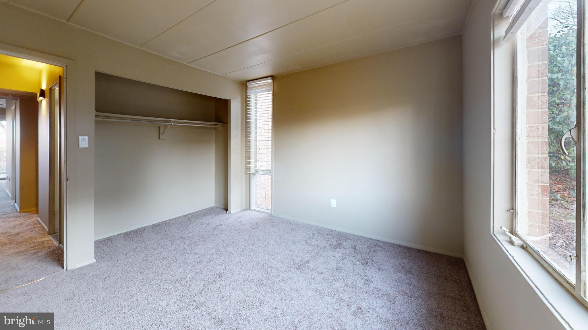 2612 Fort Farnsworth Road, Unit 262 Alexandria, VA 22303 - Photo 14 of 45 an empty room with windows and closet