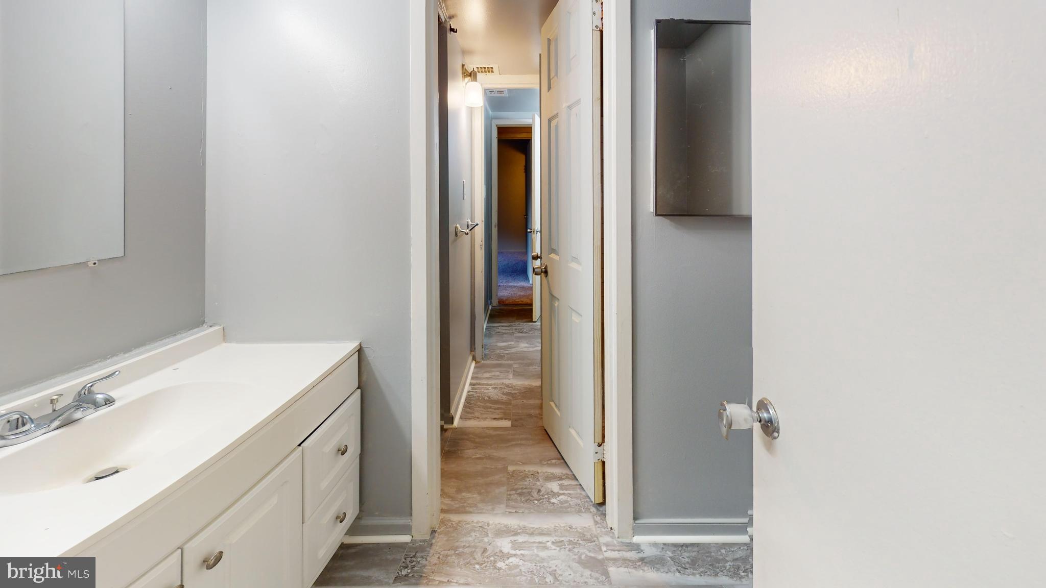 2612 Fort Farnsworth Road, Unit 262 Alexandria, VA 22303 - Photo 18 of 45 a bathroom with a sink and a mirror