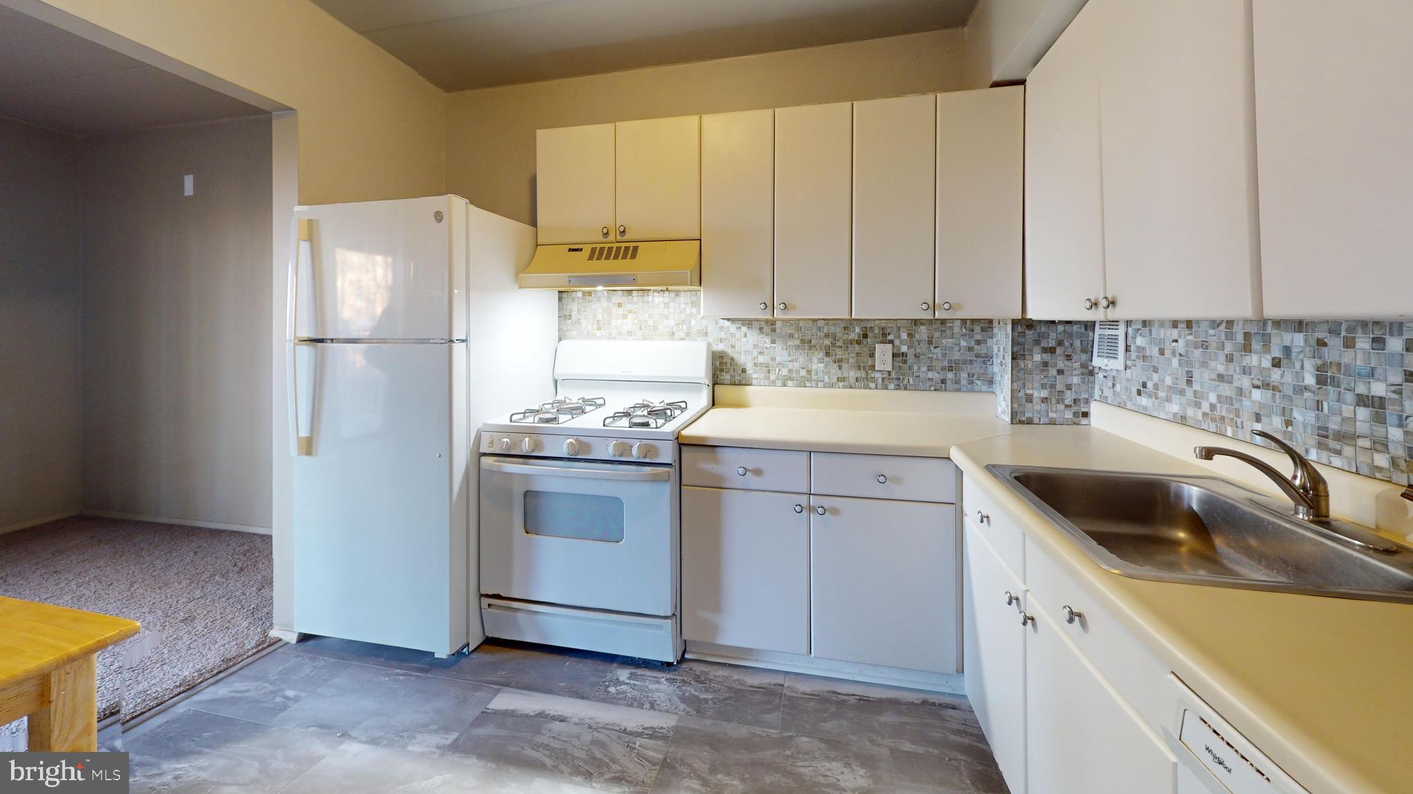 2612 Fort Farnsworth Road, Unit 262 Alexandria, VA 22303 - Photo 24 of 45 a kitchen with a sink cabinets and refrigerator