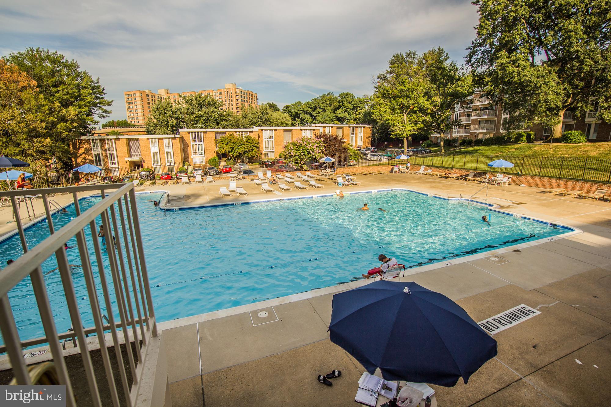 2612 Fort Farnsworth Road, Unit 262 Alexandria, VA 22303 - Photo 31 of 45 a view of a swimming pool with a yard and furniture