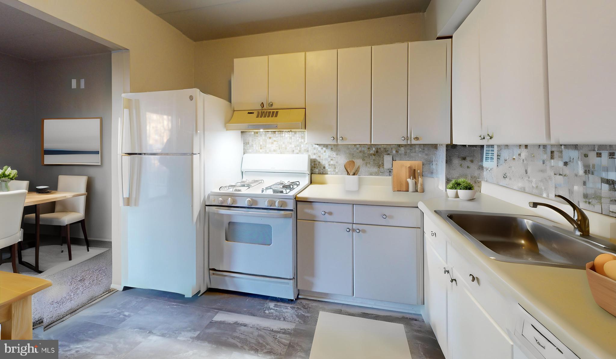 2612 Fort Farnsworth Road, Unit 262 Alexandria, VA 22303 - Photo 5 of 45 a kitchen with a sink a refrigerator and cabinets