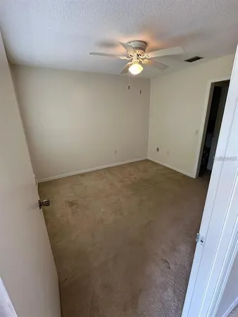 wooden floor in an empty room with a mirror