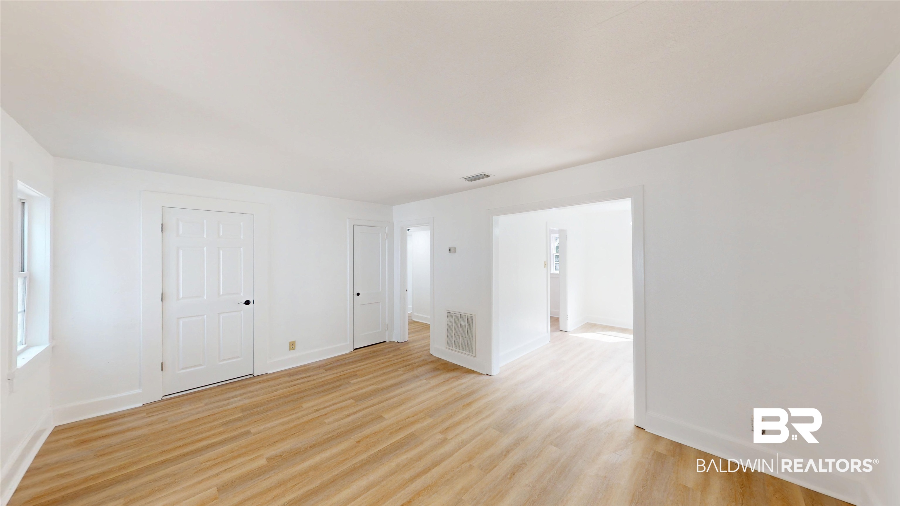 606 Shady Oak Drive Mobile, AL 36608 - Photo 4 of 14 Unfurnished room featuring light wood-type flooring and baseboards