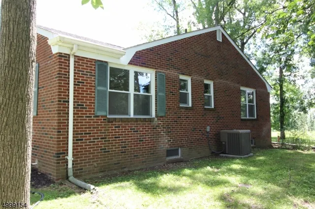 a brick house with a large windows