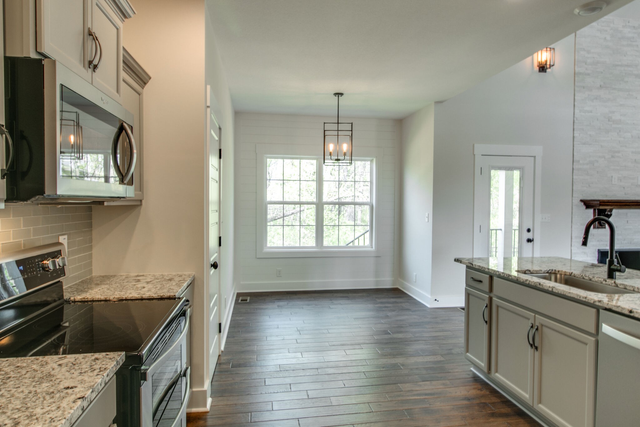 259 Harrowgate Drive Clarksville, TN 37043 - Photo 11 of 39 a kitchen with stainless steel appliances granite countertop a sink stove and cabinets