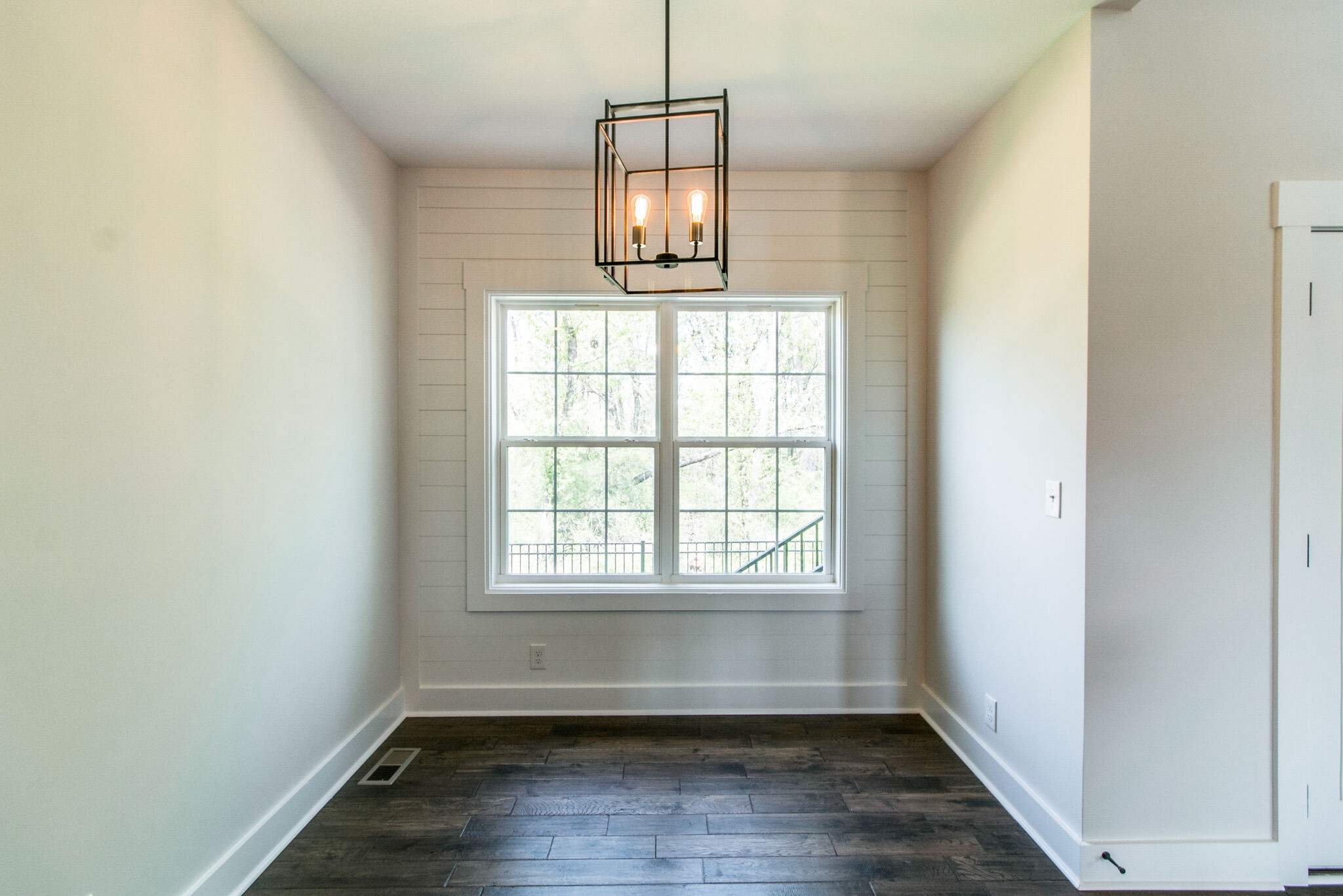 259 Harrowgate Drive Clarksville, TN 37043 - Photo 12 of 39 an empty room with wooden floor and windows